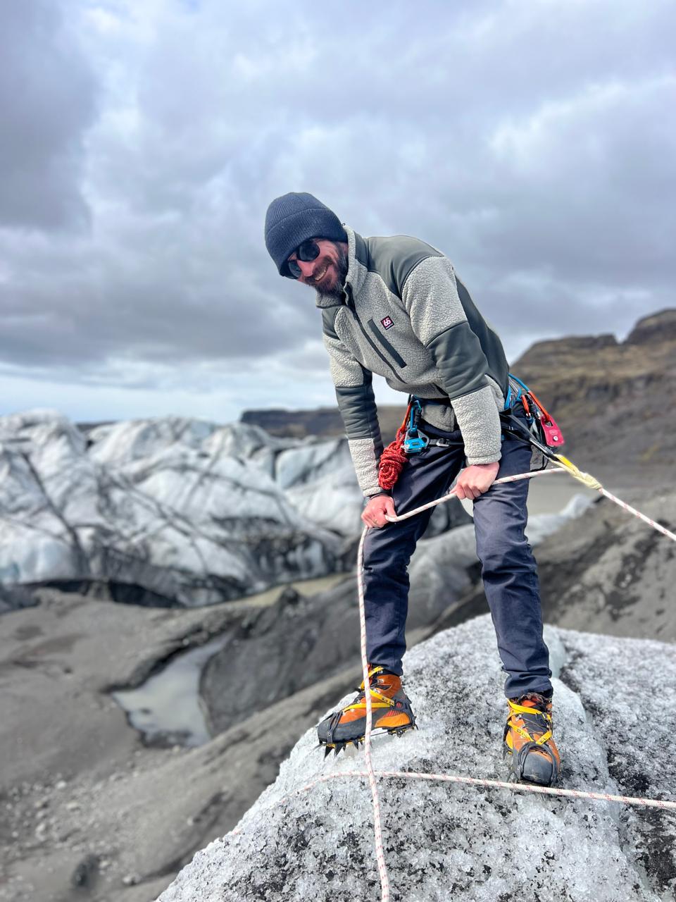 James on a glacier in Iceland, roped up with crampons and climbing gear